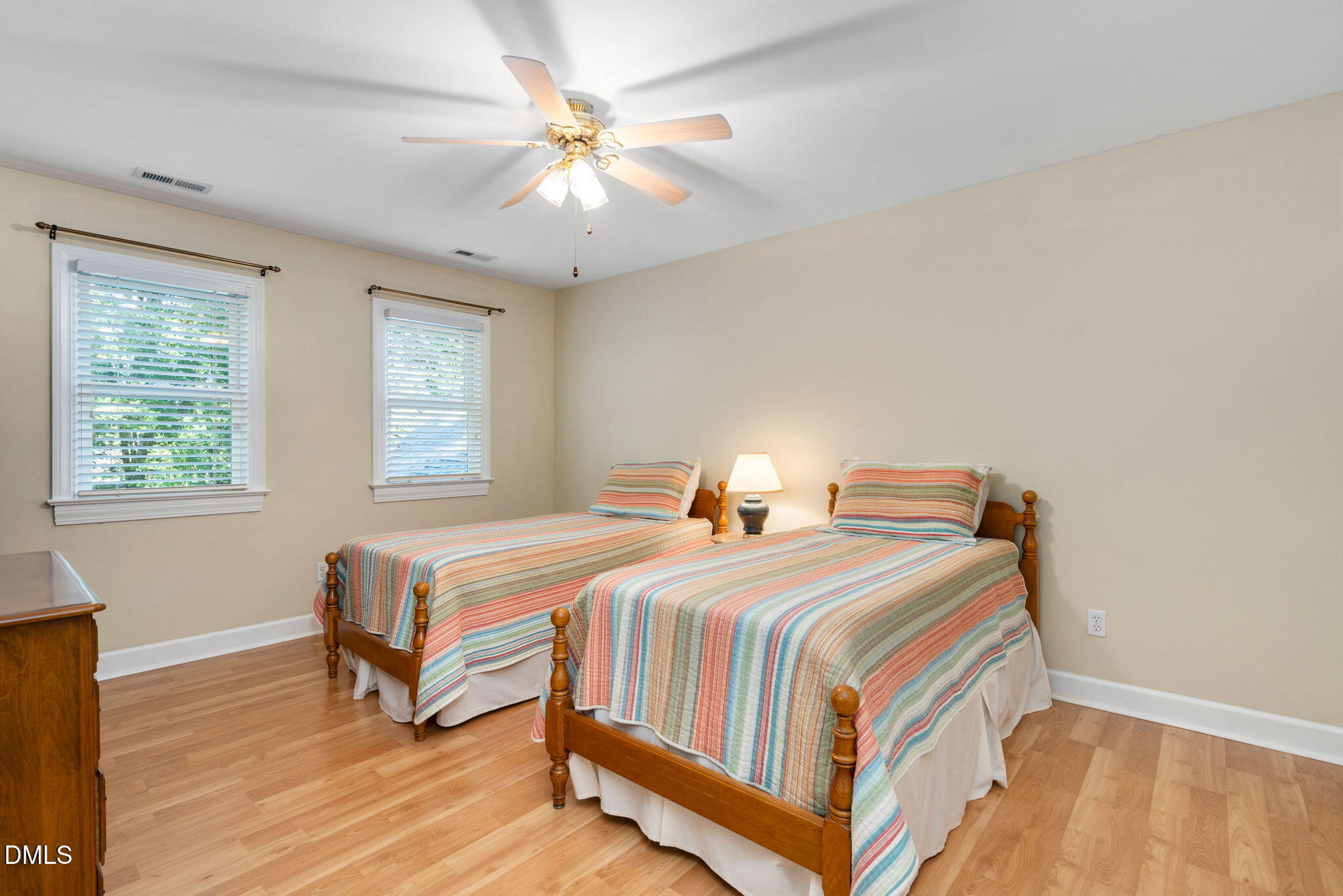 1405 October Road Raleigh, NC 27614 - Photo 21 of 40 a bedroom with a bed and a chandelier