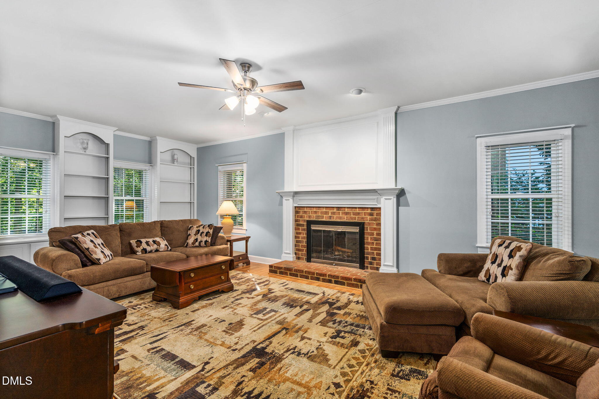 1405 October Road Raleigh, NC 27614 - Photo 5 of 40 a living room with furniture a fireplace and a large window