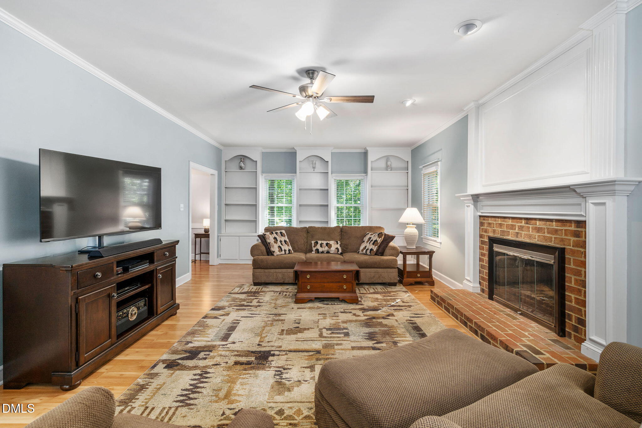 1405 October Road Raleigh, NC 27614 - Photo 6 of 40 a living room with furniture and a flat screen tv