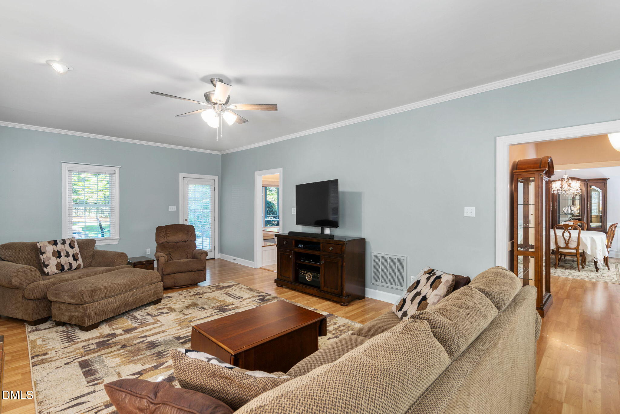 1405 October Road Raleigh, NC 27614 - Photo 7 of 40 a living room with furniture and a flat screen tv