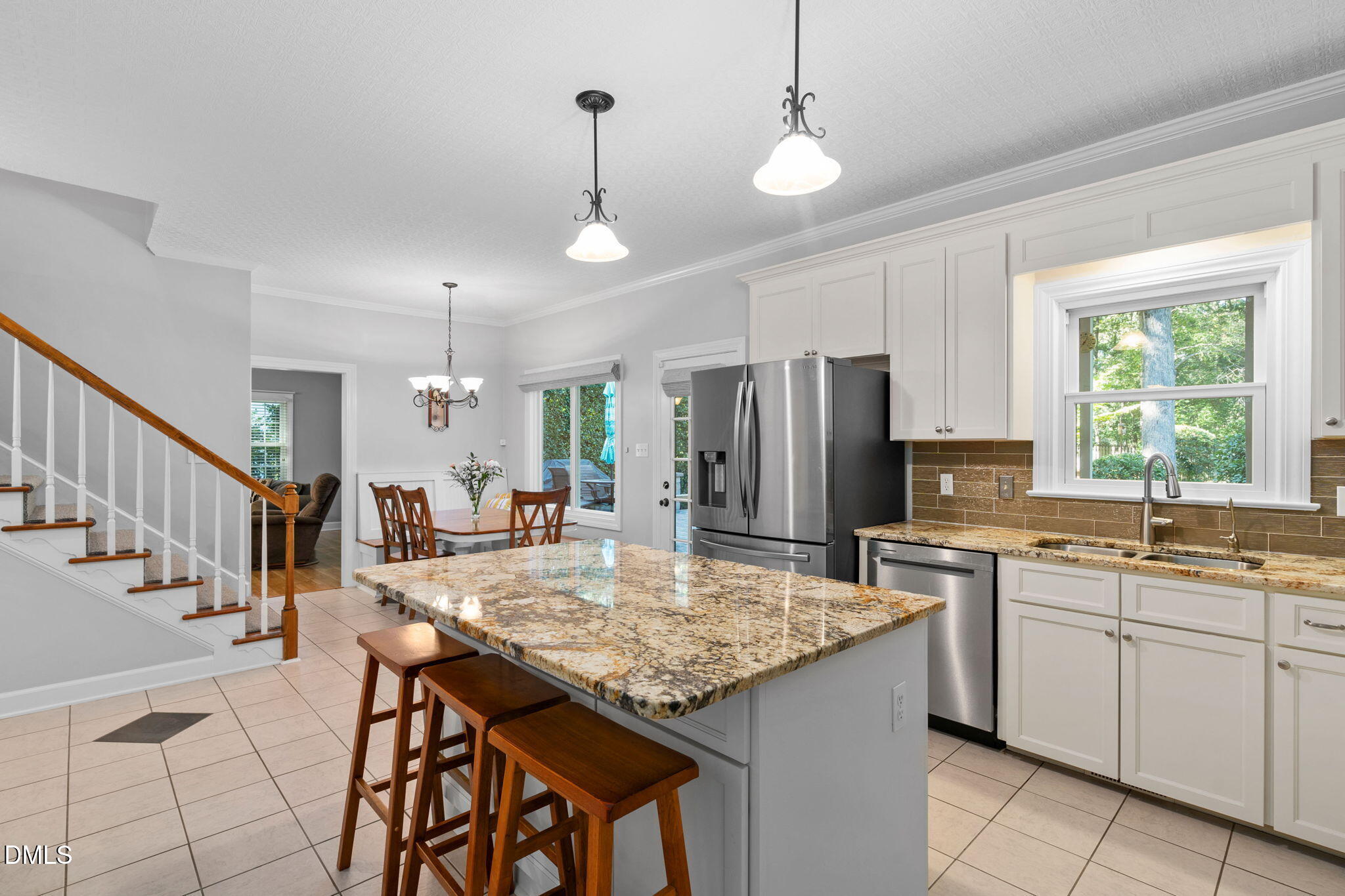 1405 October Road Raleigh, NC 27614 - Photo 8 of 40 a kitchen with sink cabinets and chandelier