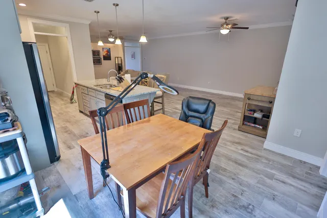 a dining room with furniture and window