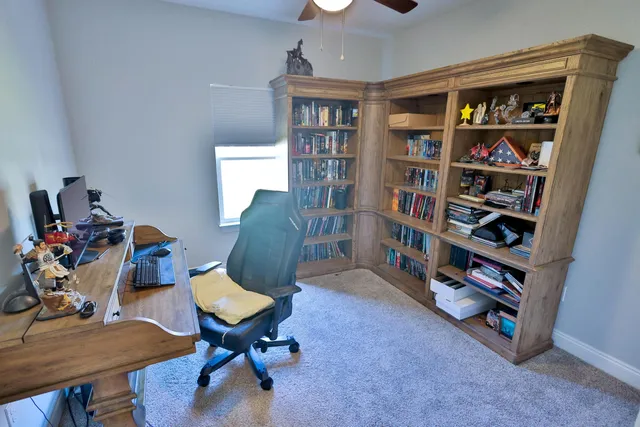 a view of a workspace with furniture and toys