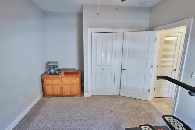 a view of an empty room and a sink