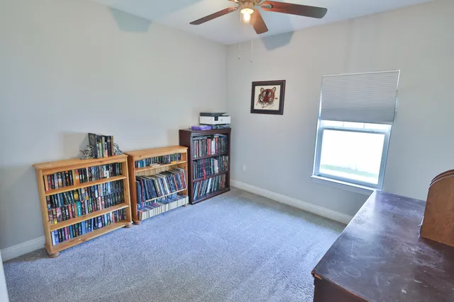 a view of a livingroom with furniture and staircase