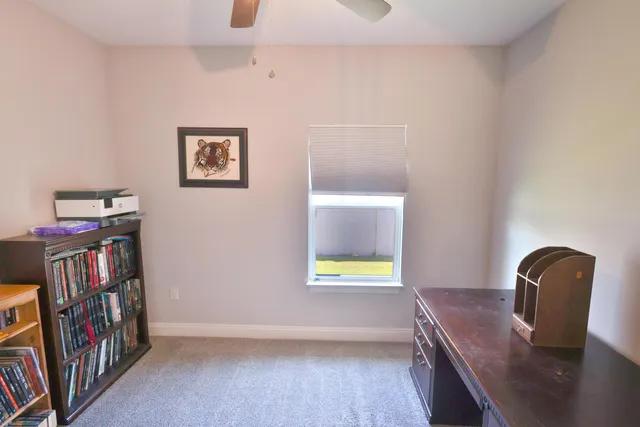 a view of a livingroom with furniture and hardwood floor