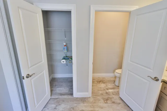 a bathroom with a toilet and a vanity