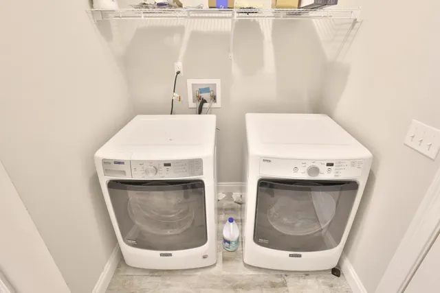 a view of front door with chandelier