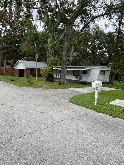 24739 Audrey Road Land O' Lakes, FL 34639 - Photo 1 of 20 a view of a house with a yard and sitting area
