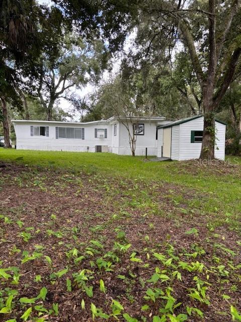 24739 Audrey Road Land O' Lakes, FL 34639 - Photo 11 of 20 front view of house with a yard