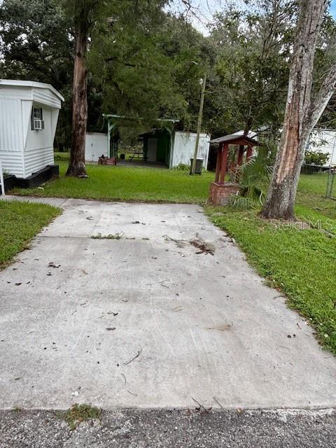 24739 Audrey Road Land O' Lakes, FL 34639 - Photo 12 of 20 a front view of a house with garden