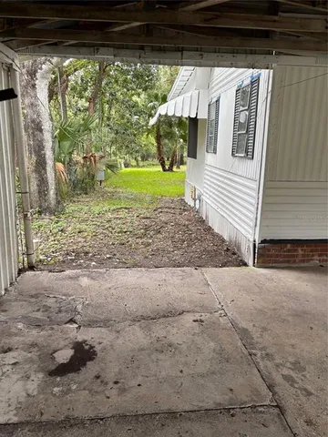 a view of a back yard of the house