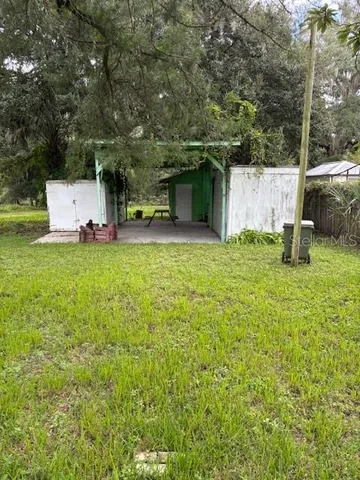 a house with a tree in front of it