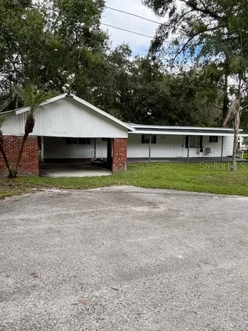 a house with trees in the background