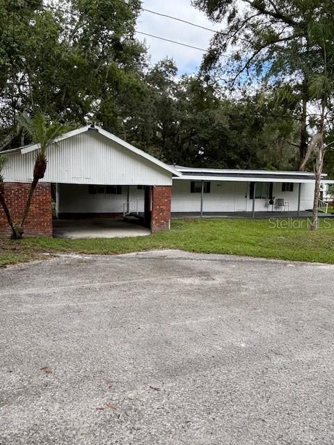 24739 Audrey Road Land O' Lakes, FL 34639 - Photo 2 of 20 a house with trees in the background
