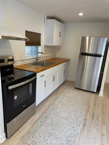 a kitchen with a stove and a sink
