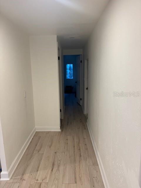 24739 Audrey Road Land O' Lakes, FL 34639 - Photo 8 of 20 a view of a room with wooden floor and a bathroom