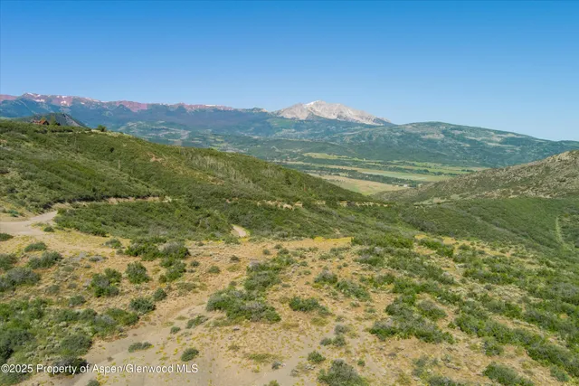 a view of a mountain with an outdoor space