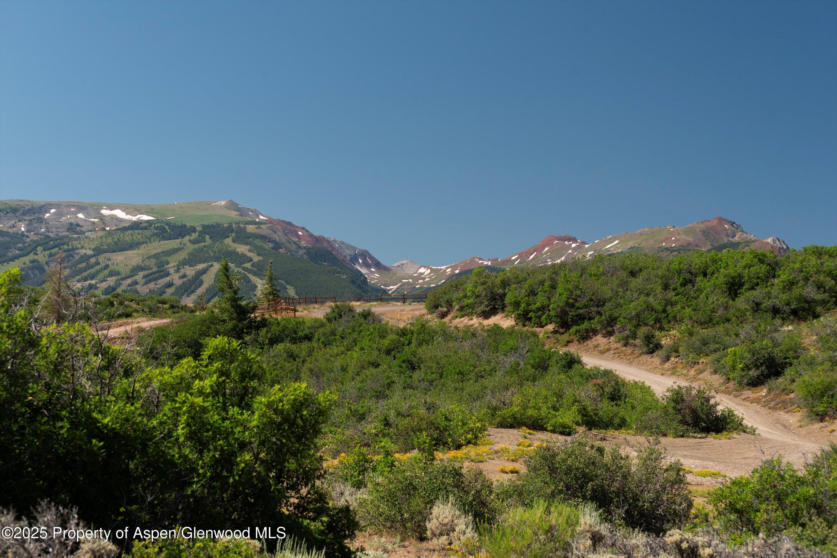Tbd Monastery Road Snowmass, CO 81654 - Photo 21 of 26 an aerial view of houses covered in trees