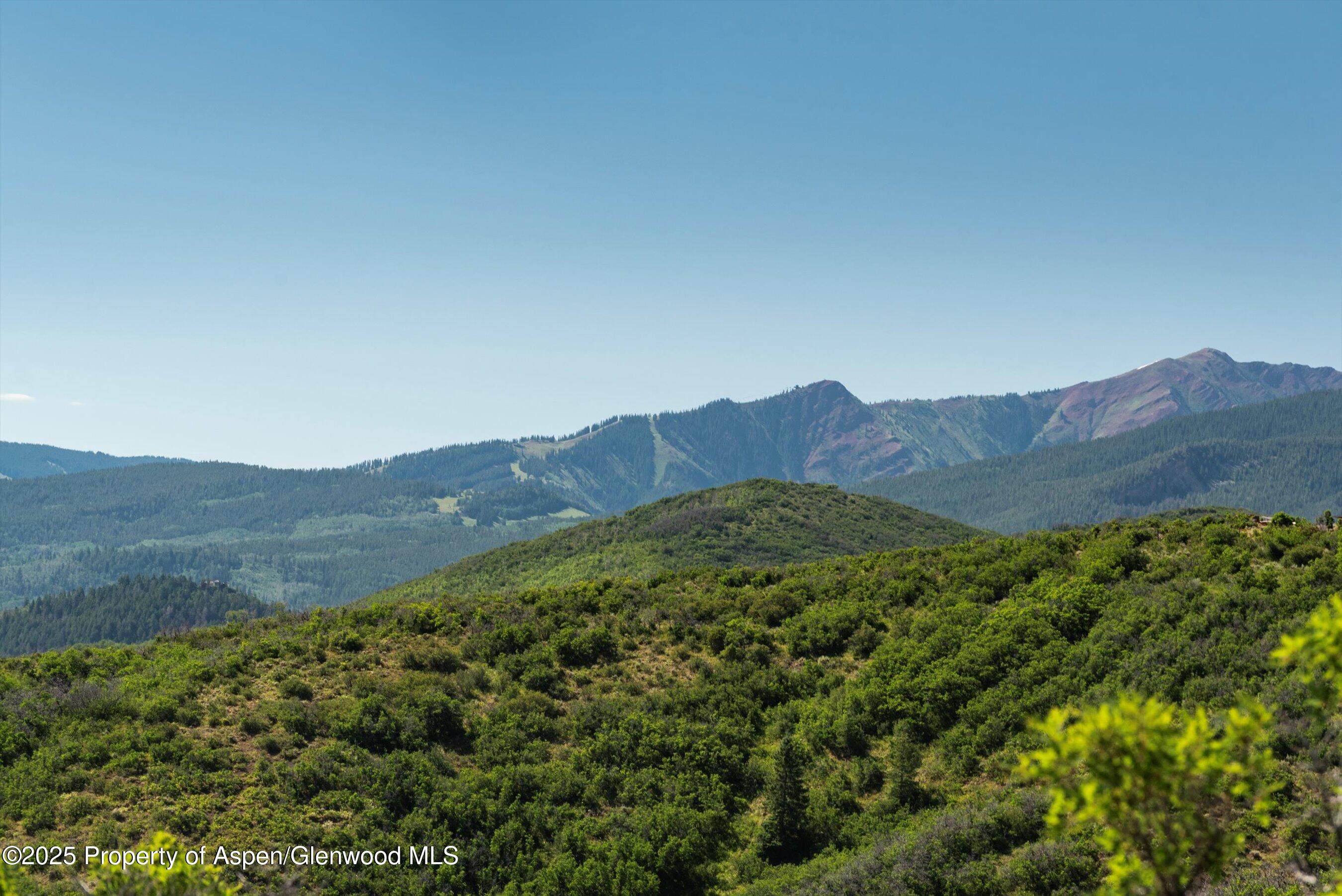 Tbd Monastery Road Snowmass, CO 81654 - Photo 25 of 26 a view of a mountain range with lush green forest