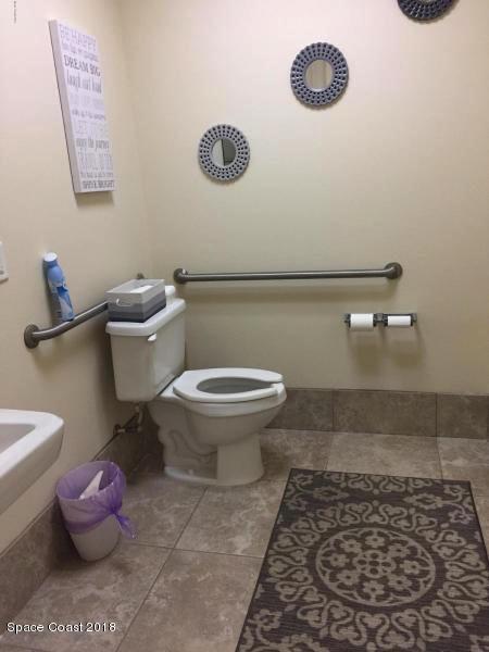 7125 Turner Road, Unit 102 Rockledge, FL 32955 - Photo 11 of 11 a bathroom with a toilet and a mirror