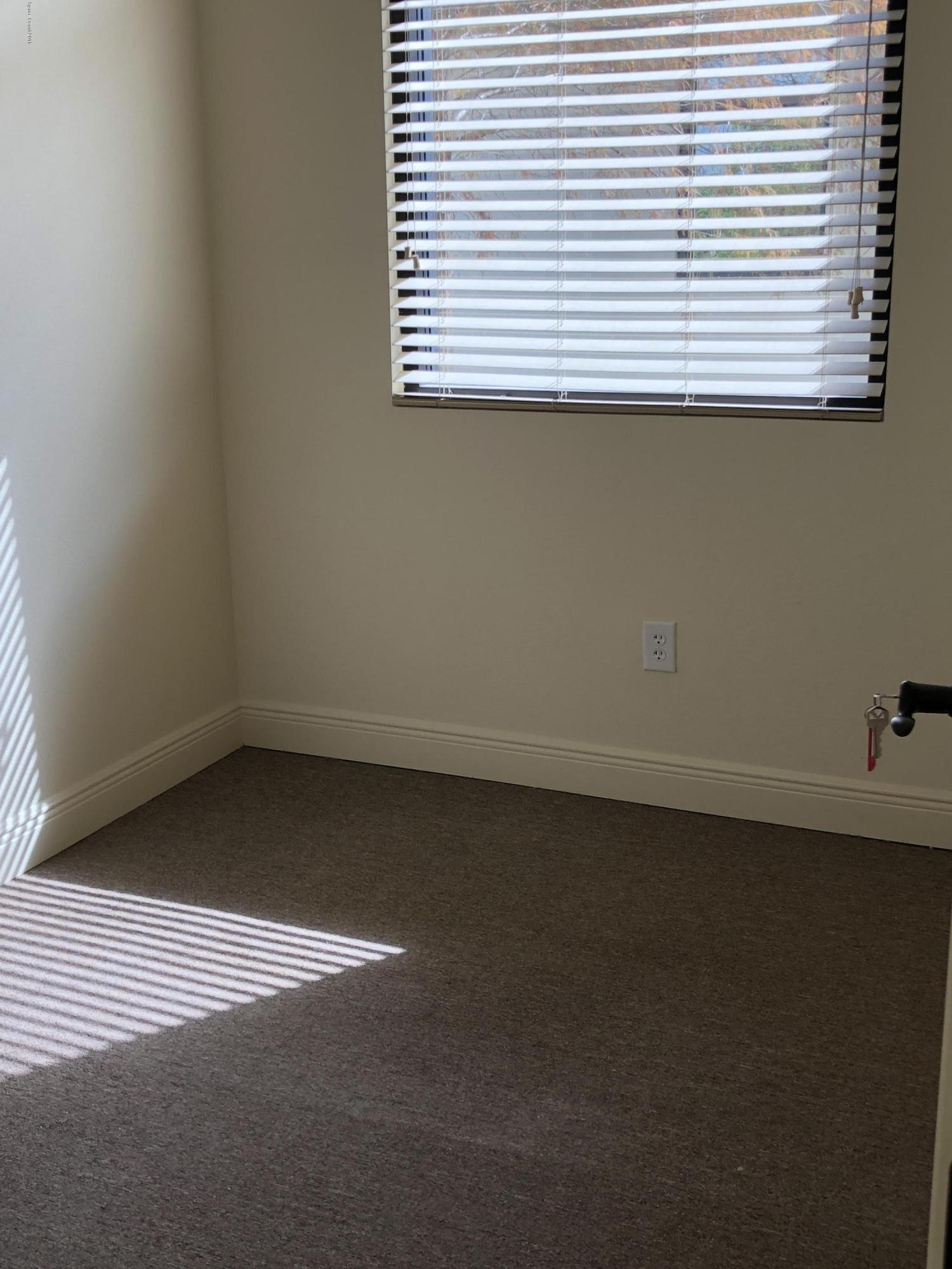 7125 Turner Road, Unit 102 Rockledge, FL 32955 - Photo 4 of 11 an empty room with a window