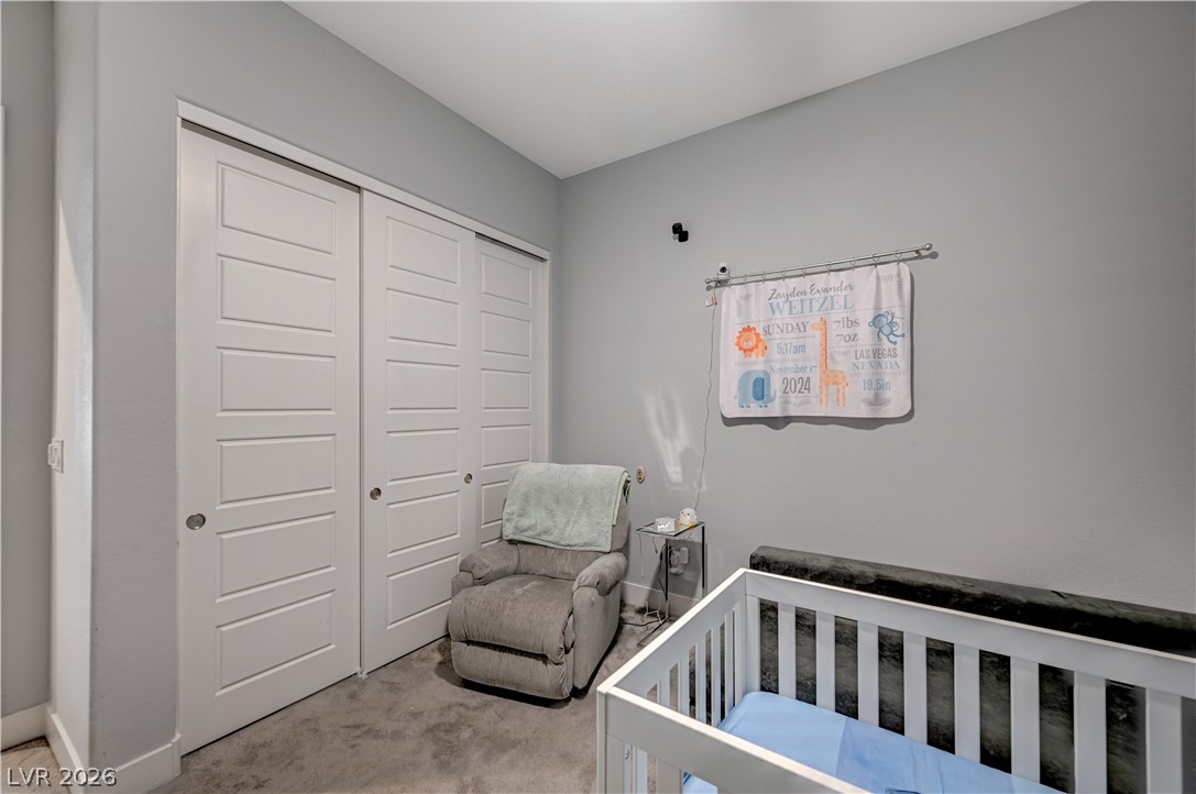 3943 Reyes Avenue Las Vegas, NV 89141 - Photo 25 of 95 Integrated closet systems and subtle lighting create a functional and calming nursery space.