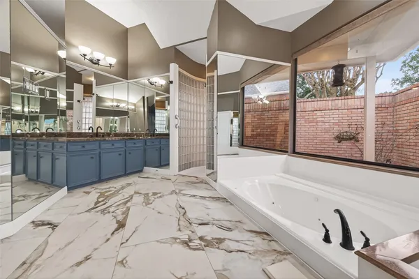 a bathroom with a bathtub and toilet