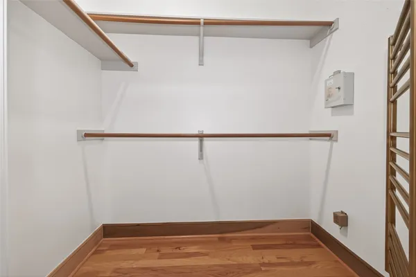 a view of a kitchen with white cabinets