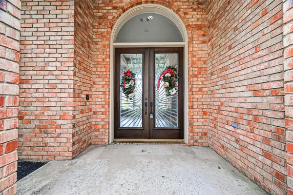 a view of an entryway of house with wooden floor