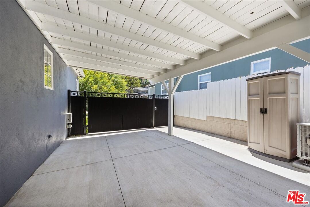 14041 Roblar Road Sherman Oaks, CA 91423 - Photo 43 of 47 a view of an empty room with a fireplace and a window