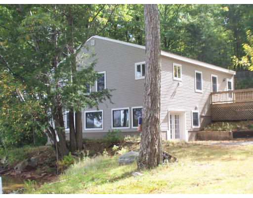 171 Mashapaug Road Holland, MA 01521 - Photo 2 of 9 a view of a house with a yard