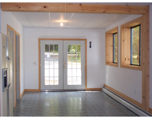 171 Mashapaug Road Holland, MA 01521 - Photo 9 of 9 a view of an empty room with glass door