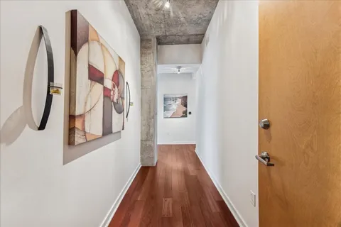 a view of a hallway with washer and dryer