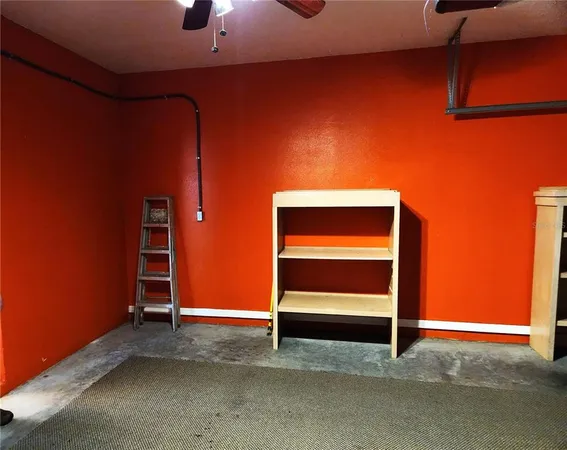 a view of an empty room with a fireplace