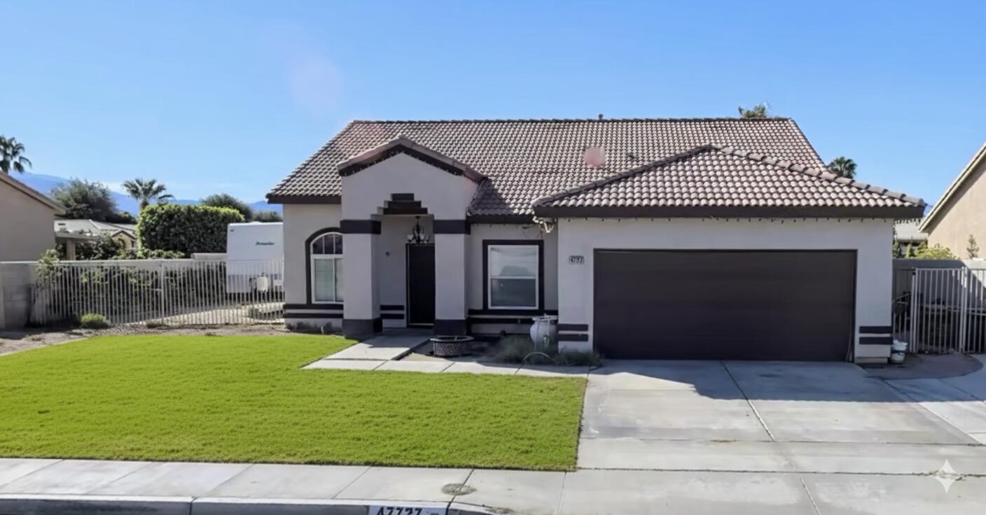 47727 Phoenix Street Indio, CA 92201 - Photo 2 of 2 a front view of a house with a yard