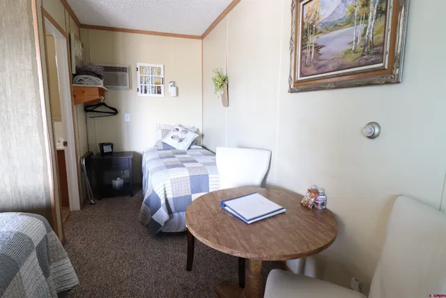 a white toilet sitting next to a bathroom sink