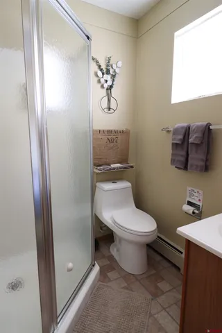 a bedroom with a bed and a table in it