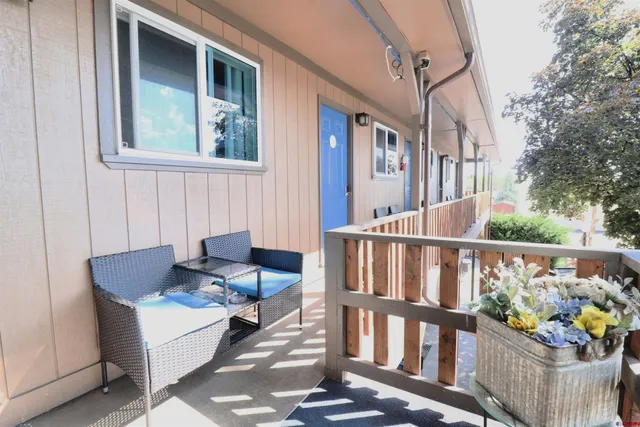 a bedroom with a bed and a table in it