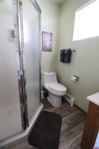 a bedroom with a bed and a chair