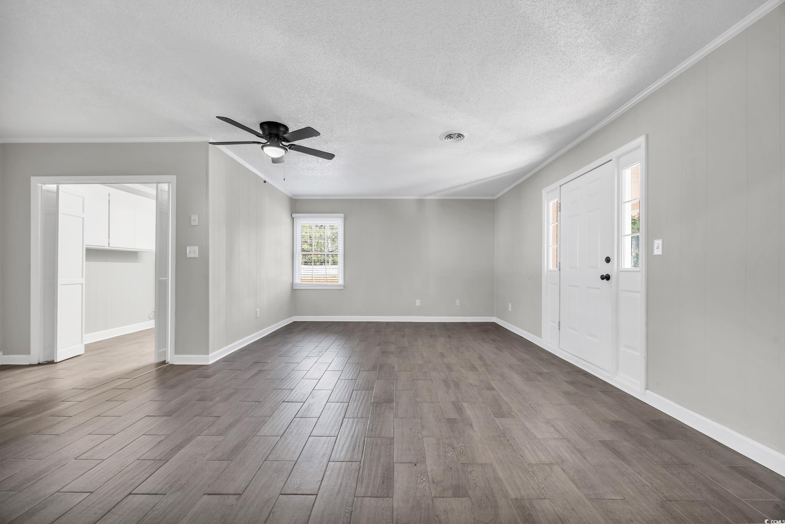2231 County Rd S-22-855 Georgetown, SC 29440 - Photo 18 of 29 Interior space featuring a textured ceiling, crown