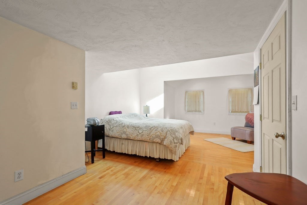 94 Fearing Hill Road Wareham, MA 02576 - Photo 7 of 41 a bedroom with a bed and a mirror