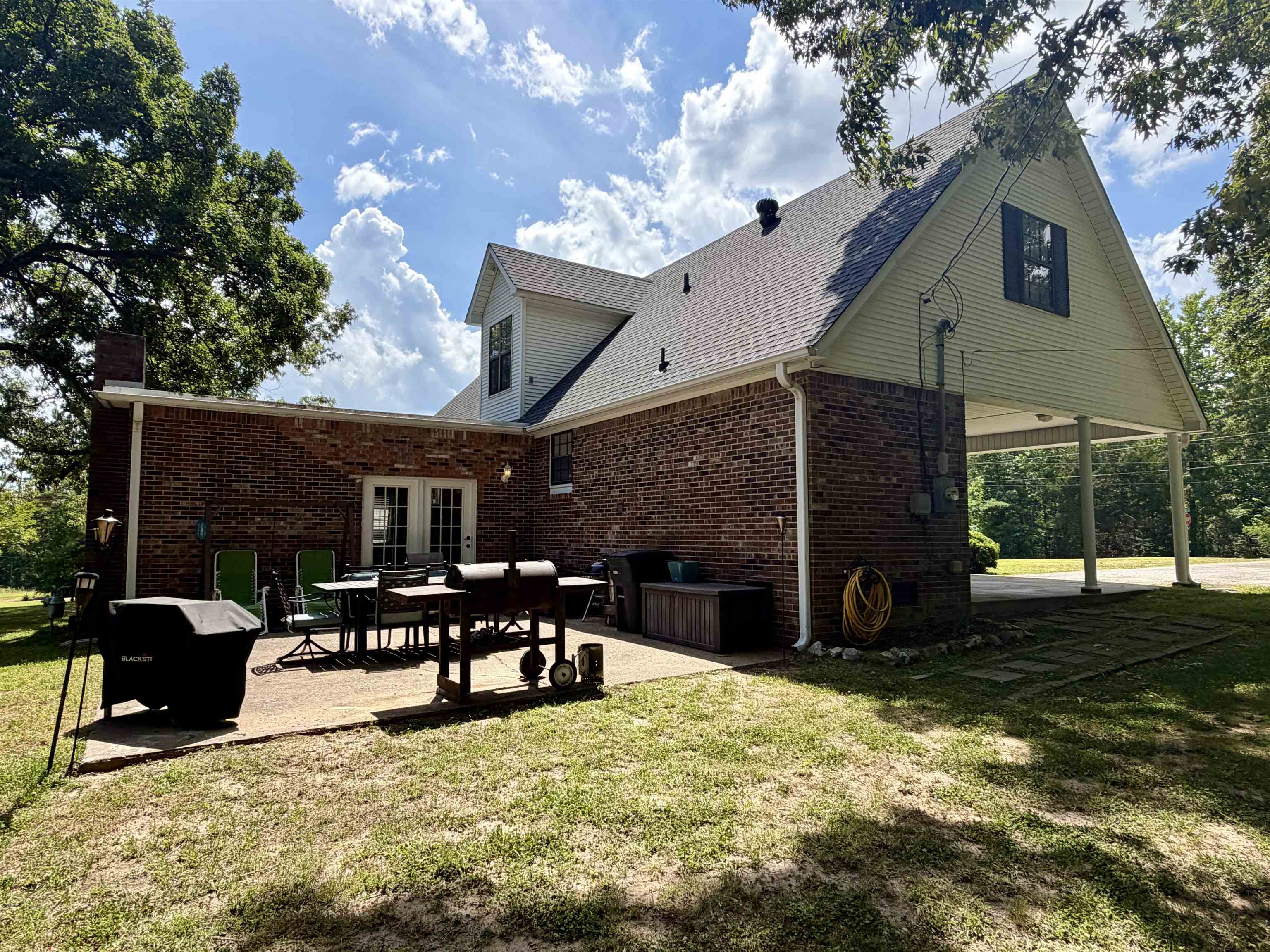 142 Treece Street Selmer, TN 38375 - Photo 27 of 36 Brick exterior featuring a gabled roofline and attached carport