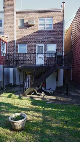 a view of a house with pool and a yard