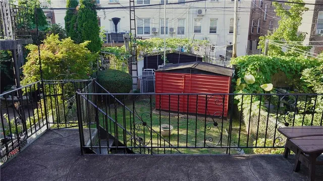 a view of a house with a flower garden