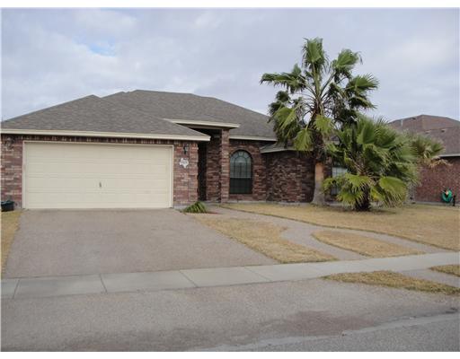 8205 Midwest Circle Corpus Christi, TX 78414 - Photo 1 of 7 a front view of a house with a yard and garage