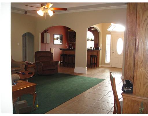 8205 Midwest Circle Corpus Christi, TX 78414 - Photo 2 of 7 a view of a livingroom with furniture and a mirror