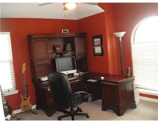 a kitchen with sink a stove and cabinets