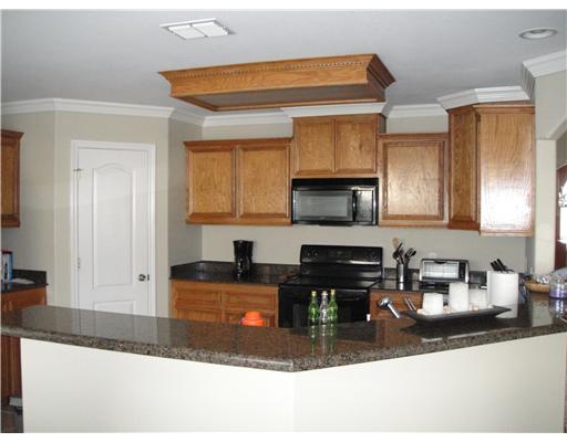 8205 Midwest Circle Corpus Christi, TX 78414 - Photo 7 of 7 a kitchen with sink a stove and cabinets