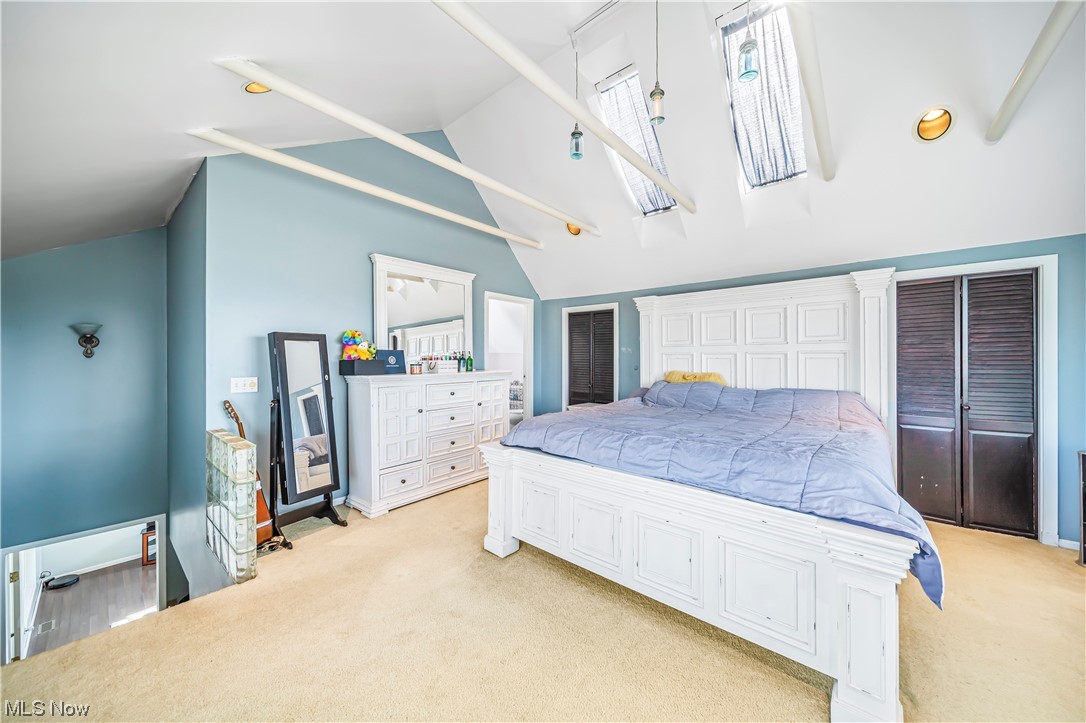 3211 River Road Perry, OH 44081 - Photo 15 of 34 Carpeted bedroom with a high ceiling and decorative columns